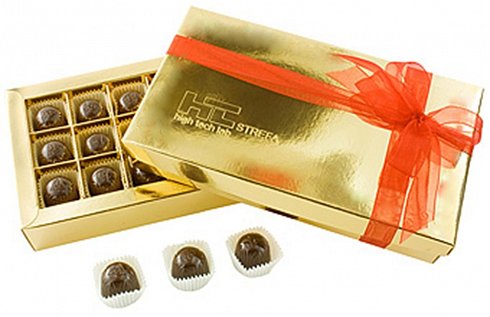 the pralines in a box with the logo